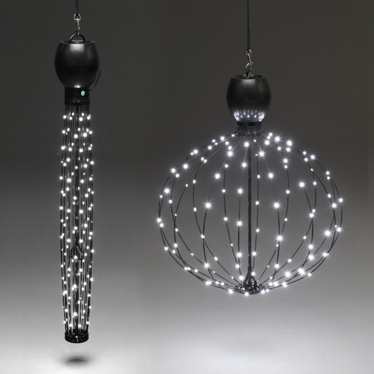 This image shows two hanging GLOWB lights side-by-side with one light on the ball or spherical shape and the other light in the tall tube shape. Both lights are powered by batteries in this photo. 