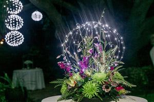 Get creative with GLOWB lights as shown here when someone added a floral arrangement to a battery powered light to create a stunning table piece with no messy wires.